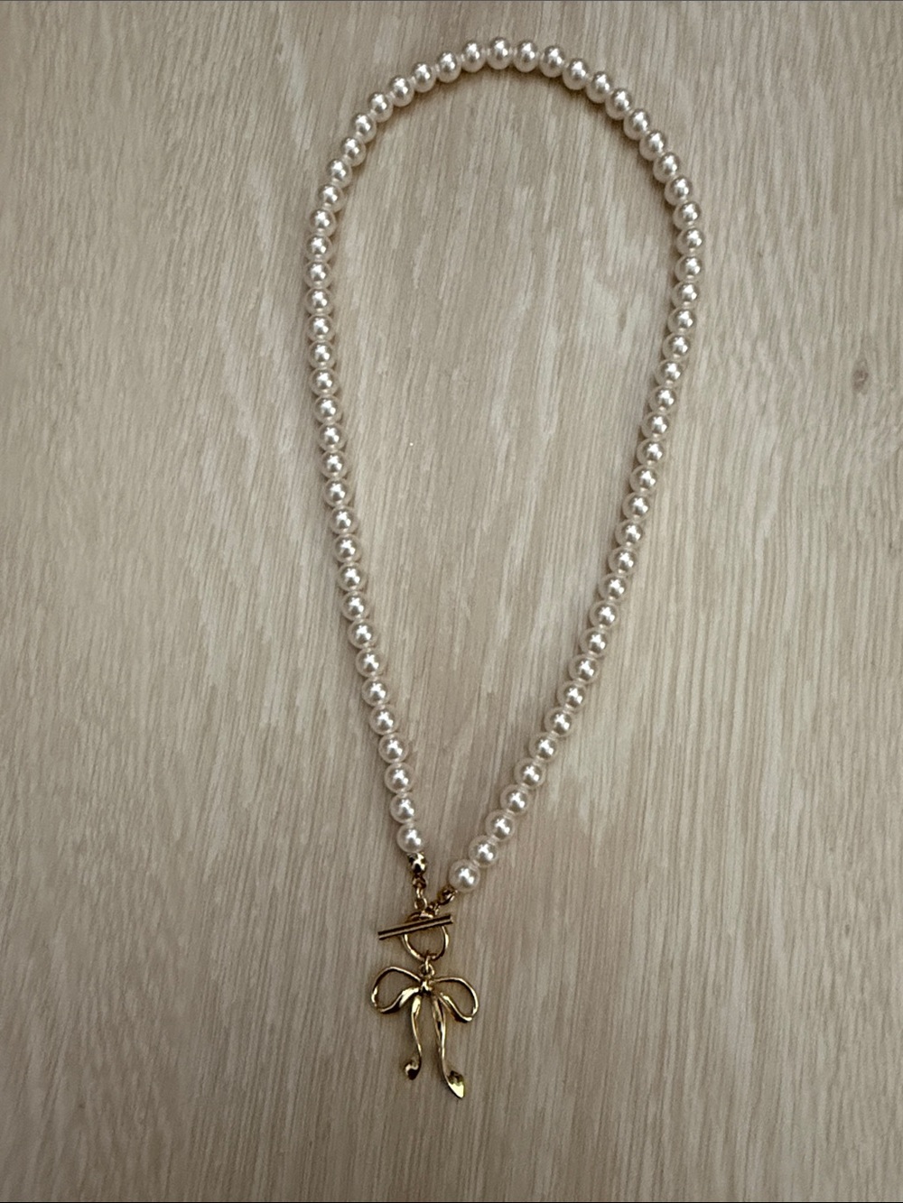 Pearl Necklace with Gold Bow Pendant